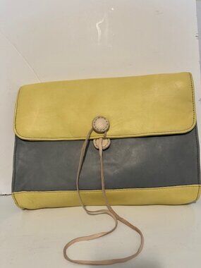 In wear color block leather clutch.